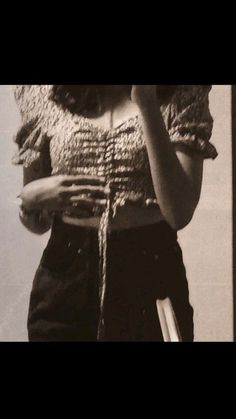 black and white photograph of a woman holding a cell phone