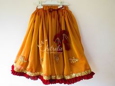 This ethnic lehenga featuring cape sleeve and jerry worked choli and tutu edged skirt accompanied with a sequienced dupatta. Please Visit My Shop For More Unique Collection https://www.etsy.com/shop/Chitralie BUYER'S PLEASE LEAVE YOUR CONTACT NUMBER. It's necessary for shipping. Fabric and Work Choli: Cape sleeve with jerry and sequence embroidered tissue fabric. The choli is lined in soft cotton fabric and ties at the back. The hanging is made with unique fabric flowers. Skirt: Gathered shimmer Traditional Ruffled Sharara For Navratri, Traditional Anarkali Set With Ruffles For Navratri, Ruffled Traditional Wear For Navratri, Festive Traditional Wear With Ruffles For Navratri, Navratri Festive Traditional Wear With Ruffles, Festive Anarkali Set With Ruffles For Diwali, Festive Ruffled Anarkali Set For Diwali, Traditional Navratri Dresses With Ruffles, Traditional Ruffled Dresses For Navratri