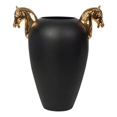 a large black vase with gold horse decorations on the top and bottom, sitting in front of a white background