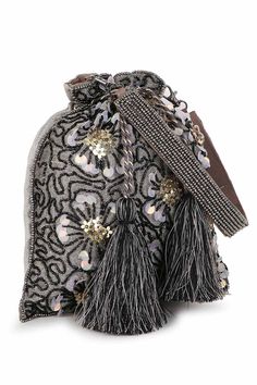 This Grey, Black & Gold Potli comes with a spacious main compartment secured with a Drawstring closure. It features a Floral Embellished Pattern on Polyester fabric and comes with a Detachable Wrist loop decorated with Tassels. Product Features: Color: Grey, Black & Gold Fabric: Faux Silk Pattern: Floral Embellished Style: Floral Embellished Potli with Drawstring Closure Surface Style: Tasselled Strap / Handle: Wrist loop Strap Adjustable: Non-Adujstable Strap Detachable: Detachable Shape: Others Care: Wipe with a clean and dry cloth Water Resistance: No Dimension (L x H x W): 20 x 23 x 4 cm Model Name: Dangle Occasion: Party Product Type: Potli Disclaimer: There will be slight difference in digital to actual image Festive Party Bags With Tassels, Festive Evening Bags With Tassels, Glamorous Party Bags With Tassels, Luxury Embellished Elegant Potli Bag, Glamorous Embellished Festive Potli Bag, Luxury Embellished Potli Pouch Bag, Luxury Embellished Glamorous Potli Bag, Luxury Gold Embroidered Potli Bag, Party Handbags