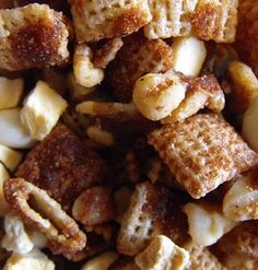 a pile of cereal that is sitting on top of a blue plate with white and brown toppings