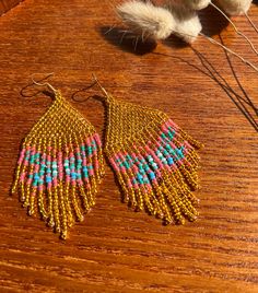 Fringe butterflies beaded earrings Made of  🖤 gold colored czech beads 🖤 multicolored butterfly pattern 🖤 nickel free hooks (gold plated) They measure 9.5cm length and 4 cm width.  Free shipping UK 🌈 🖤 Please check out our shop  https://www.etsy.com/uk/shop/JewellerybyMadalina  if you want to see other handmade products, especially earrings, necklaces and more bracelets.  🖤 Follow us on Facebook https://www.facebook.com/jewellerybymadalina/ 🖤 Follow us on Instagram to be first to see the Butterfly Seed Bead, Fringe Bead Earrings, Butterfly Wing Jewelry, Earrings Butterfly, Beaded Earrings Diy, Seed Bead Patterns, Be First, Earrings Diy, Gold Butterfly