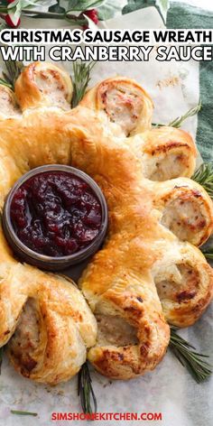 a christmas sausage wreath with cranberry sauce on it and the words, christmas sausage wreath with cranberry sauce