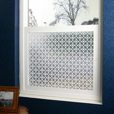 a window in a room with blue walls