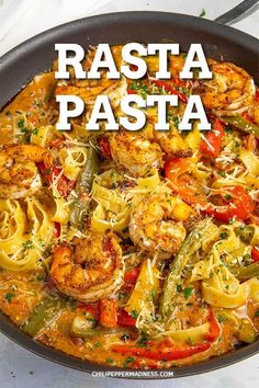 a skillet filled with pasta and shrimp