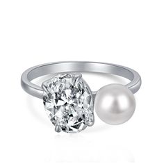 This gorgeous Sterling Silver Double Ring has been designed to be a dupe for Ariana Grande's exquisite engagement ring. It's crafted with a beautiful water pearl and 5A oval cubic zirconia inlaid into the sterling silver. It is a perfect engagement or bridal party gift, as well as an everyday wear for the fashionista bride. Solid 925 Sterling Silver Rhodium Plated Oval 5A Cubic Zirconia 10x8mm Pearl And Diamond Engagement Ring, Zircon Jewelry, Cubic Zirconia Rings, Pearl Gemstone, Elegant Ring, Designer Engagement Rings, Ring Sterling Silver, Pearl Ring, Sterling Ring