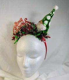 Add holiday spirit to your hairstyle with this fun, bright , tacky headband ! Handmade using festive holiday ornaments that sparkle and shine, set on a 1 inch wide, satin headband . Each unique headband is handcrafted with great care and  attention to detail . A perfect and fun  accessory for all of your holiday festivities!  Headband is 13 inches from end to end, over the head .   Headband contains small embellishments that can be a choking hazard to small children.  HANDLE EMBELLISHED HEADBAND Unique Headband, Embellished Headband, Headband Handmade, Christmas Sweater Party, Satin Headband, Embellished Headbands, Party Headband, Christmas Headband, Ugly Christmas Sweater Party