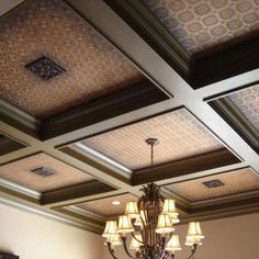 a chandelier hanging from the ceiling in a room