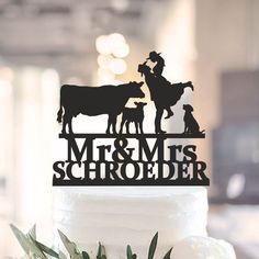 a cake topper that says mr and mrs schroeder with farm animals on it