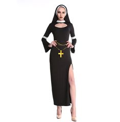 a woman wearing a nun costume with a cross on her chest and leg, standing in front of a white background