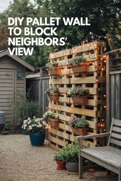 a pallet wall with potted plants on it and the words diy pallet wall to block neighbor's view