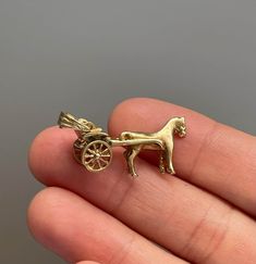 Vintage 14k Yellow Gold Horse & Carriage Charm Era: Vintage, Mid Century Condition: Good Vintage Condition Materials: 14k Solid Gold Size: 26mm x 10mm x 12mm weight: 4.81 grams Modest Christian Clothing, Gold Horse, Horse Carriage, Christian Clothing, Pendant Necklaces, Solid Gold, Jewelry Necklace Pendant, Accessory Gift, Jewelry Necklaces