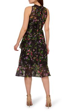 Vivid blooms bring watercolor-inspired beauty to a shimmery jacquard chiffon dress designed with a high mock neck and tiered skirt. 42" length Hidden back zip; back tie closure Mock neck Sleeveless, with cutaway shoulders Partially lined 100% polyester Dry clean Imported Work Wear Outfits, Floral Chiffon Dress, Halter Midi Dress, Cocktail Attire, Puff Sleeve Dresses, Halterneck Dress, Black Cocktail Dress, Adrianna Papell, Petite Dresses