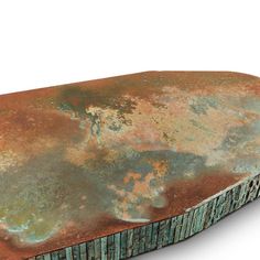 an old, rusted metal object is shown on a white background