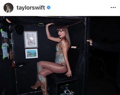 taylor swift is posing in her dressing room