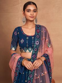 Introducing our stunning "attractive blue embroidered georgette function wear lehenga choli", a must-have for any special occasion. This exquisite ensemble features a blue georgette lehenga with intricate sequin work and embroidered detailing, a matching georgette choli with embroidery and sequin work, and a net dupatta in a similar color adorned with embroidery work, sequins, and a heavy lace border.
The lehenga is semi-stitched up to 42 inches with a 3.5-meter flair, while the choli material i Blue Zari Work Party Wear Pre-draped Saree, Designer Blue Pre-draped Saree With Mirror Work, Festive Semi-stitched Georgette Choli, Festive Blue Georgette Pre-draped Saree, Blue Georgette Saree Set, Unstitched Blue Pre-draped Saree With Intricate Embroidery, Unstitched Blue Set With Blouse, Festive Georgette Lehenga With Pallu, Blue Designer Wear Sets With Mirror Work