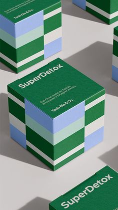 four green and white business cards with the word superdetox on one side