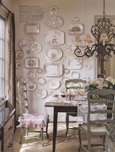 a dining room with plates on the wall