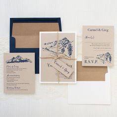 the wedding stationery is laid out on top of each other