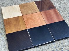 several different types of wood are on the floor in various colors and shapes, including black, white, brown, blue, yellow