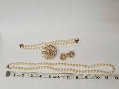 Vintage pearl necklace bracelet brooch & earring set antique collectible wedding jewelry. this is a beautiful set was found in the oneil's box. unmarked. in good vintage condition. please see all photos for details. thanks for looking and be sure to check out our other items! we have lots of vintage items. we put new listings on daily so be sure to check back often. don't forget to add us to your favorites list! hughesantique Coral Beads Necklace, Pearl Necklace Vintage, Vintage Pearls, Coral Beads, Vintage Pins, Estate Jewelry, Favorite Things List, Necklaces Bracelets, Antique Jewelry