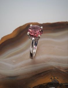 CJ70530-9 Maine tourmaline solitaire ring. 14k white gold scroll design solitaire ring set with Maine pink tourmaline. This gorgeous, round brilliant tourmaline is 2.52cts, approximately 9mm. The gemstone is from the Dunton Quarry in Newry, Maine. Currently the ring is size 6, we will resize at no extra charge if needed, please specify ring size at checkout. Newry Maine, Solitaire Ring Set, Gold Solitaire Ring, All Gems, 14k Rose Gold Ring, Scroll Design, Tourmaline Ring, Fine Jewels, 14k White Gold Ring