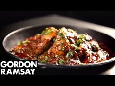 a close up of food in a bowl on a table with the words gordon ramsay above it