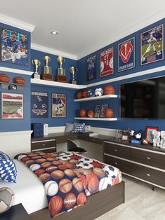 a bedroom with blue walls and sports themed decor