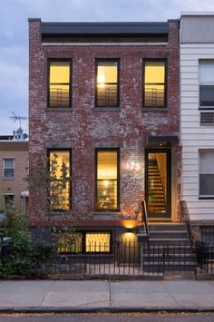 two story brick building with stairs leading up to it