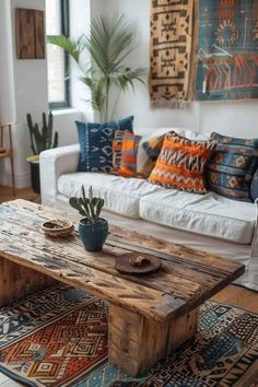 a living room filled with furniture and lots of pillows on top of it's wooden table