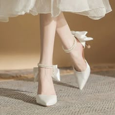 Flutter into style with Bella Chix's Darling Delicate Butterfly Pointed Toe Heels. Made for chic brides, these high heels feature a delicate pearl strap and pointed toe, providing a unique and elegant touch to any bridal look. Walk down the aisle with confidence and grace in these must-have heels. Product Specifications Fashion Element: Butterfly-knot Heel Type: Thin Heels Toe Shape: Pointed toe Upper Material: Silk Item Type: Pumps Outsole Material: Rubber Lining Material: PU Closure Type: Buck Sandals Woman, Pearl Butterfly, Shoes Heels Classy, Fashion Shoes Heels, Chic Brides, White Wedding Shoes, Womens Shoe, Heels Classy, Fancy Shoes