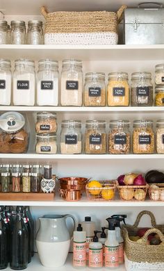 the shelves in this kitchen are filled with different types of spices and food items to choose from