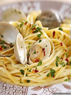 pasta with clams and parsley on a plate