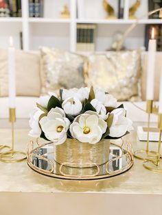 a table with candles and flowers on it