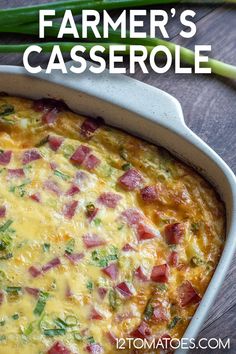 a casserole with ham and cheese in a white dish on a wooden table