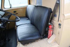 the interior of an old truck is clean and ready to be used as a seat