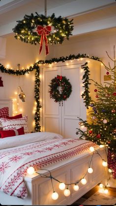 a bedroom decorated for christmas with wreaths and lights