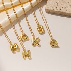 Add a touch of elegance to your everyday look with our 18K Gold Sleek & Puffed Initial Necklace. The sleek design and high-quality material make this necklace the perfect accessory to elevate your style. Personalize with your initial and make a statement with this puffed necklace. Necklace Length: Approx. 40 cm, plus extender of 5 cm, Cable chain Pendent Height: Approx. 15 mm Finish: 18K Gold Filled Intial Necklace, Unrealistic Wishlist, Alphabet Charm, Letter Pendant Necklace, Couple Jewelry, Necklace Necklace, Demi Fine Jewelry, Letter Pendants, Necklace Length