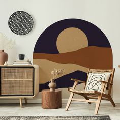 a living room with an abstract wallpaper and wooden furniture, including a rattan chair