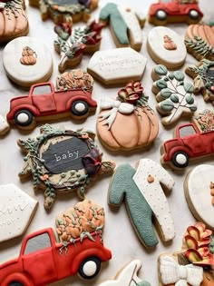 many decorated cookies are arranged on a table