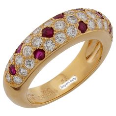 This classic authentic Cartier ring is crafted in 18k yellow gold and pave-set with brilliant-cut round E-F-G VVS1-VVS2 diamonds and round red rubies. Made in France circa 1994. Measurements: 0.23" (6mm) width. The ring size is 6.25 - EU 53. Resizable. Sizing fees will be provided upon request. Excellent condition. Comes with original box without paperwork. Gold Ruby Rings With Pave Setting, Luxury Round Ruby Ring With Diamond Accents, Luxury Ruby Ring With Diamond Accents And Round Shape, Yellow Gold Ruby Rings With Pave Setting, Luxury Red Ring With Pave Setting, Luxury Red Diamond Ring With Single Cut Diamonds, Luxury Ruby Diamond Ring With Pave Setting, Luxury Ruby And Diamond Ring In Yellow Gold, Luxury Ruby Ring With Diamond In Yellow Gold