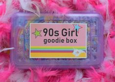 a plastic box with the words 90's girl goodie box written on it