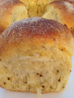 a piece of bread that has been cut in half and is sitting on a white surface