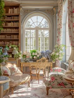 a living room filled with lots of furniture and flowers in vases on the windowsill