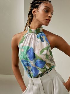 Crafted from crepe de chine, Praslin Silk Top features a mock neck and sleeveless cut. The eye-catching botanical pattern perfectly complements the beach-inspired design, adding a touch of whimsy and vibrant energy to your wardrobe. Silk Halter Top, Silk Sleeveless Top, Mock Neck Blouse, Painting Floral, Botanical Design, Silk Knit, Stripe Silk, Botanical Pattern, Silk Charmeuse