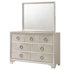 a white dresser with a mirror on top of it and drawers in front of it