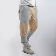 Fashionable youth and men's trousers. Made in patchwork style - two colors and details. Comfortable fit, two deep side pockets and two rear cargo pockets. An insert (gusset) is sewn between the legs, thanks to which it is very convenient to play sports and move around in pants. Sewn from quality material - a footer with a three-thread loop. Density 310 g / m2. Composition 70% cotton, 30% polyester.This model is multifunctional. Can be used for jogging, sports, regular biker use, cosplay and more Casual Cotton Pants With Contrast Color, Streetwear Cotton Pants With Contrast Color, Streetwear Cotton Bottoms With Contrast Color, Cotton Bottoms With Contrast Color For Streetwear, Contrast Color Cotton Pants For Streetwear, Casual Cotton Color Block Pants, Urban Jogging Pants With Side Pockets, Streetwear Color Block Cotton Bottoms, Color Block Cotton Bottoms For Streetwear