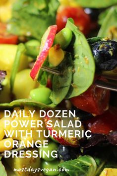 colorful salad with text overlay reading daily dozen power salad with turmeric dressing