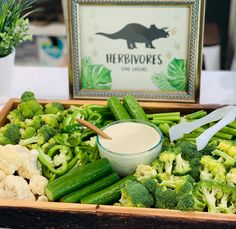 broccoli, cauliflower, celery and other vegetables in a wooden box