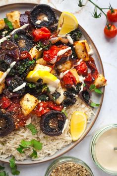 a plate filled with rice and vegetables on top of a table